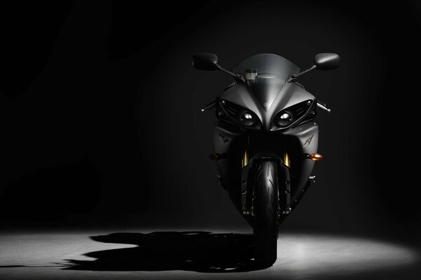 Black Yamaha sport bike casting a shadow