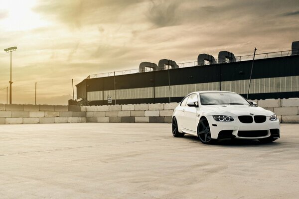 White BMW coupe on the industrial site