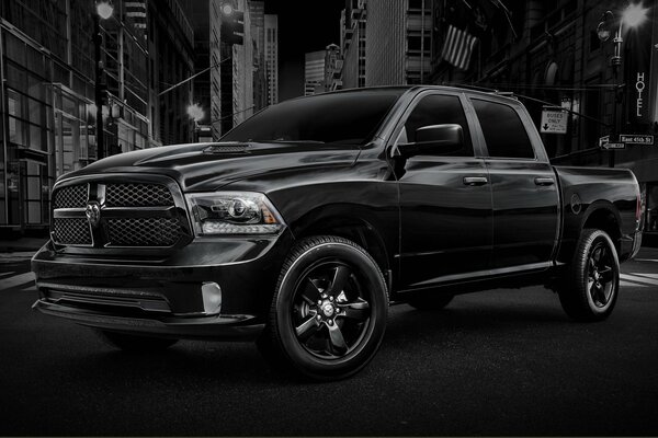 Black Dodge pickup truck on a noir background