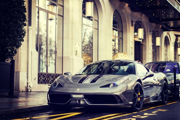 Ferrari Speciale is parked near the building