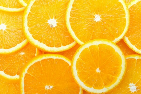Oranges en coupe sur tout le fond