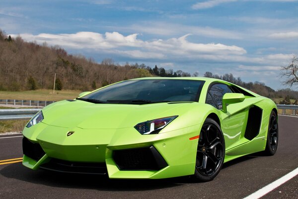 Green Lamborghini aventador on the road