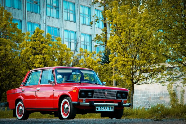 Red retro car in the parking lot