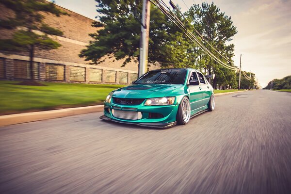 Tuning turquoise Mitsubishi lancer