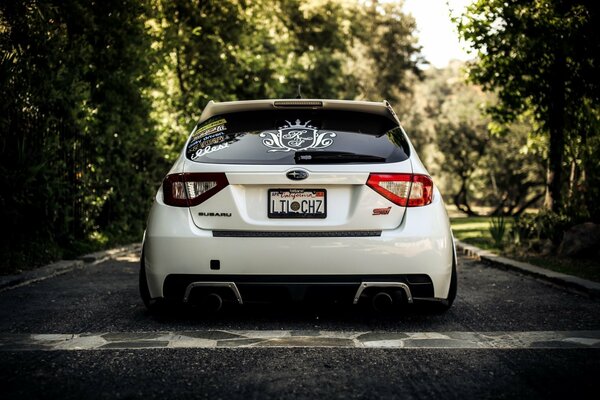 White subaru impreza car on the road