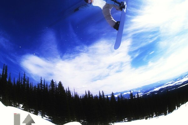 A snowboarder performing a trick in the air