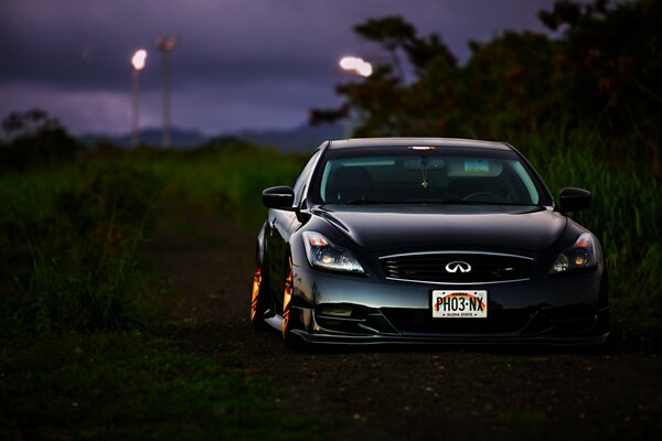 Infiniti g35 coupe in the night background