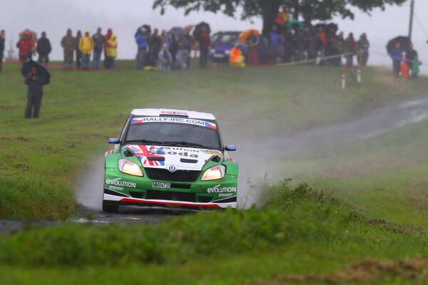 Skoda Fabia drives past the spectators on the highway