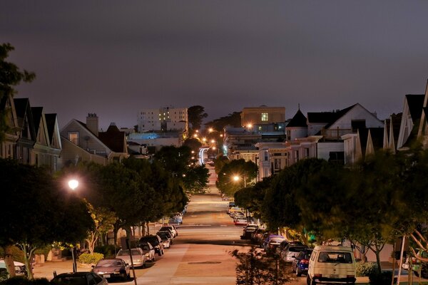 California s evening street with lots of cars