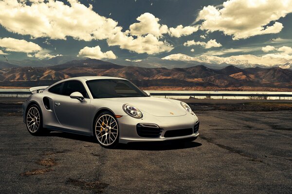 Legendary sports car silver Porche 911, magazine photo