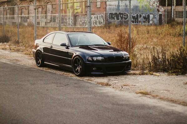 Black BMW car on the side of the road