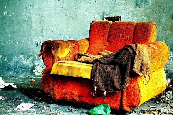 A lonely sofa survivor of a fire