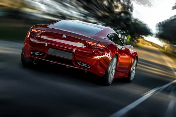 Hermoso coche rojo monta en la carretera