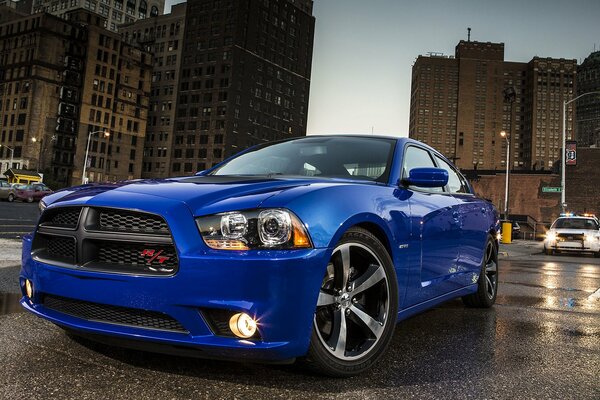 Blue car on the background of city streets