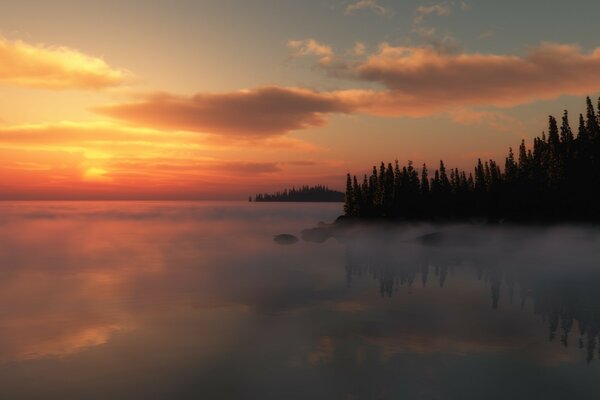 Misty sunset over the lake