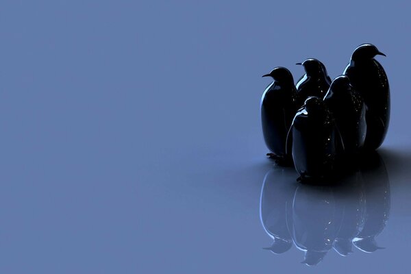 Figure of five black penguins