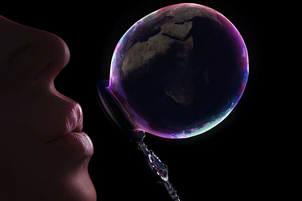 Blowing soap bubbles on a dark background