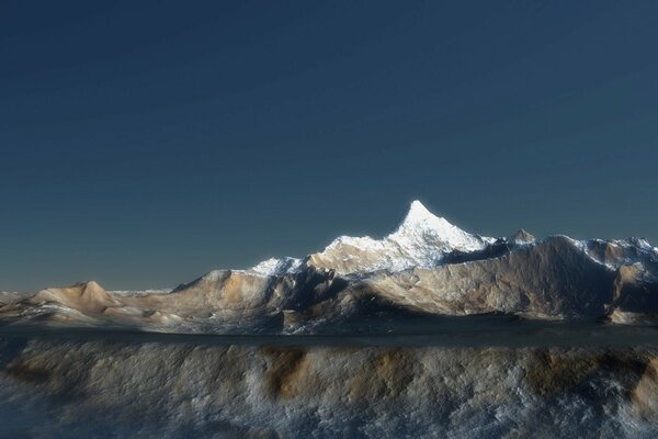 Snow-capped mountains are reflected in the water