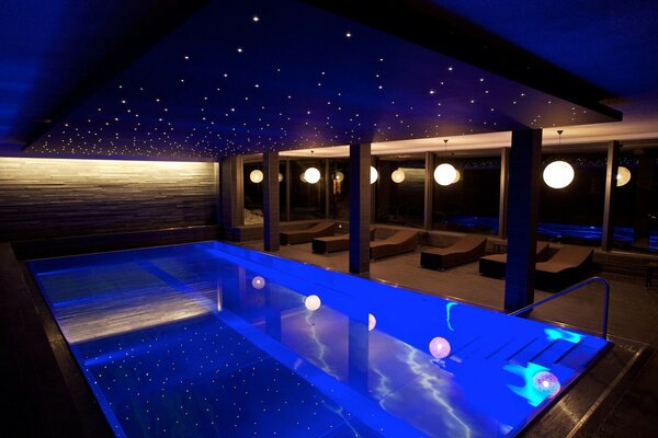 Swimming pool under the starry sky. Paradise vacation