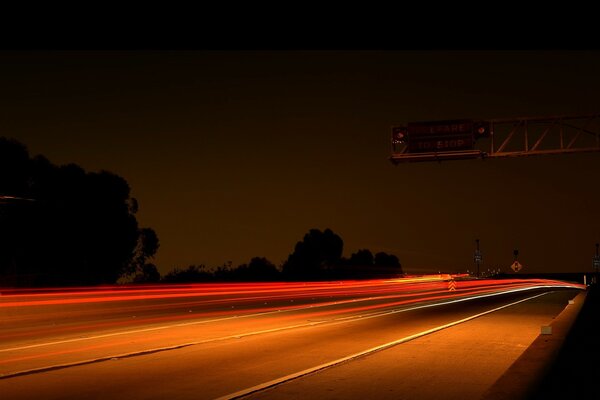 Night highway among many lights