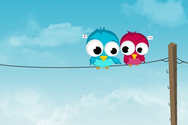 Two cute birds sitting on a wire