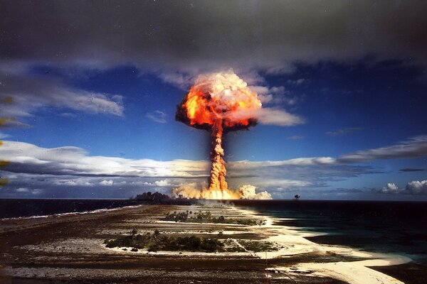 Nuclear explosion against the blue sky