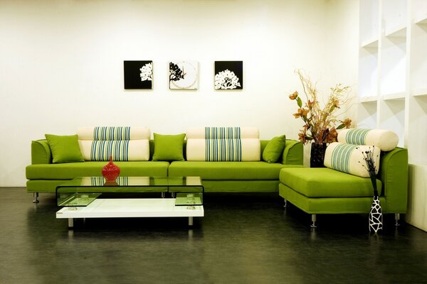 Design of a room with a green sofa