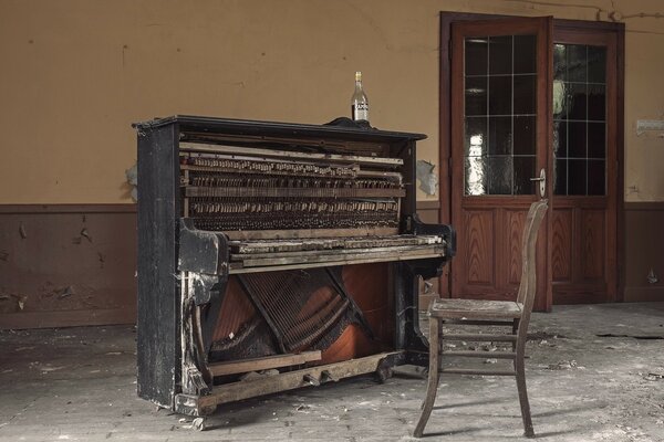 An abandoned building with a piano room