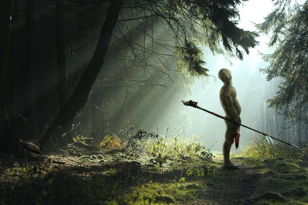 Guerrier poilu avec une lance dans la forêt