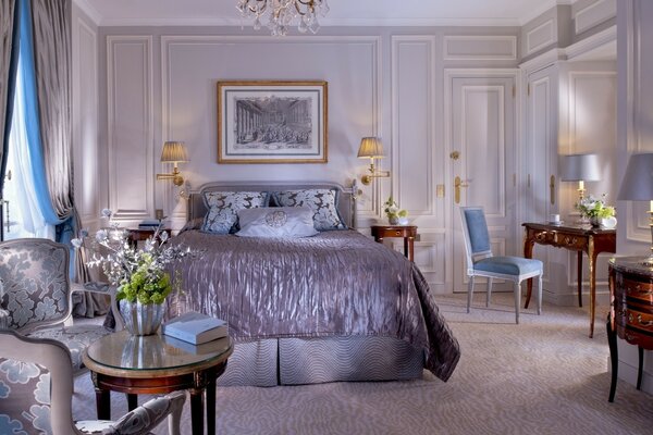 Bedroom in light colors with gray and brown details