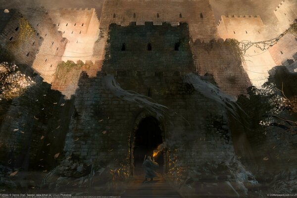 A traveler stands at the castle with a torch