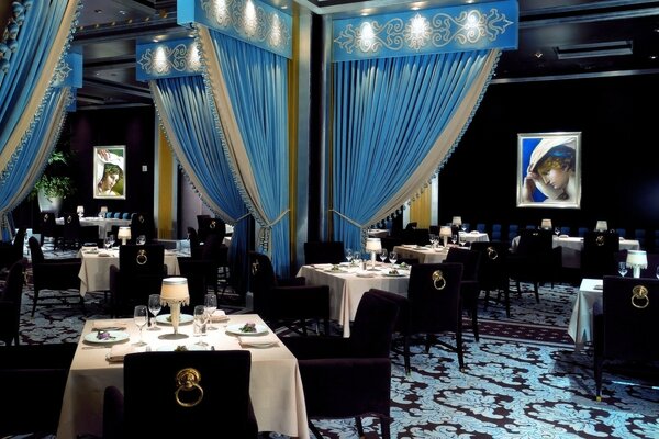 Restaurant with blue design and paintings