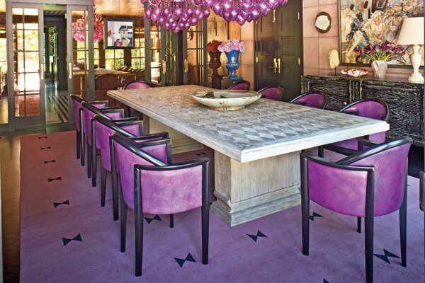 Dining room with a large table in lilac tones