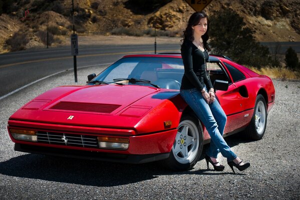 Fille assise sur une Ferrari rouge 328