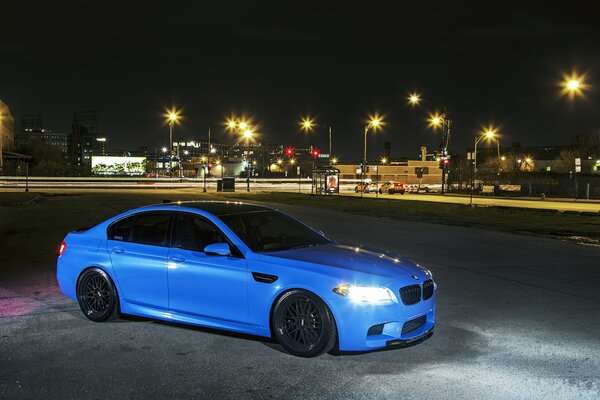Blue bmw under the cover of night