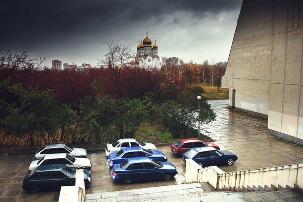 Tuned domestic cars on the background of the temple