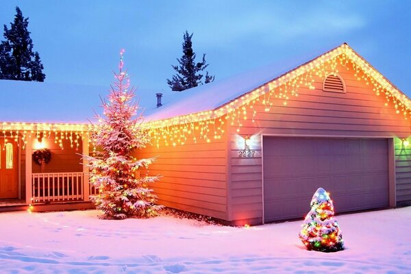 Snow-covered New Year s house and Christmas tree