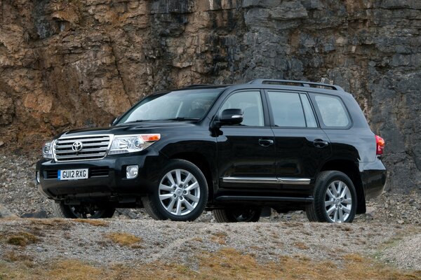 Toyota v8 SUV on the background of mountains