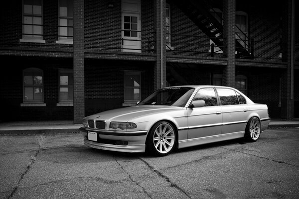 White bmw 740 e38 on a grey background