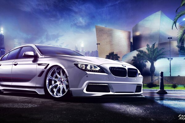 Bmw 6 series in white on the background of the night city