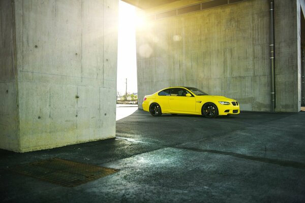 Yellow car on black wheels