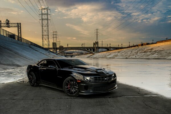 Chevrolet Camaro on the background of a post and power lines