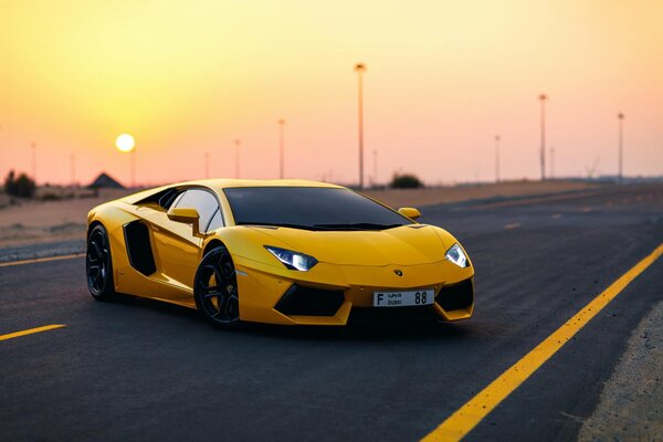 Yellow Lamborghini - sports car on the track, lights on