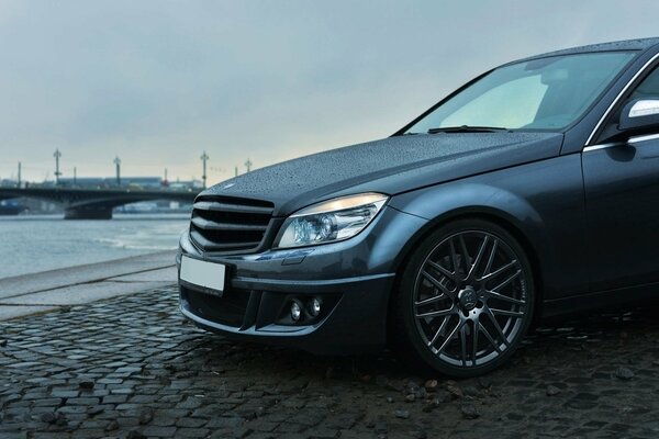 Mercedes brabus on the pavement against the background of the St. Petersburg bridge