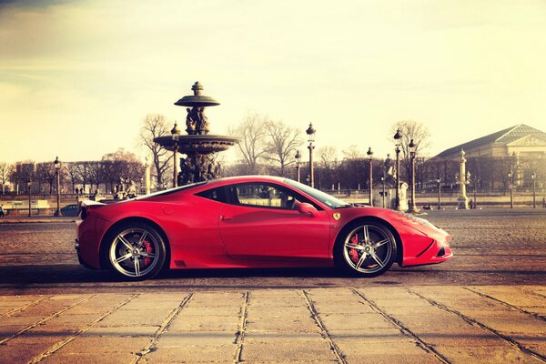 Wallpaper with a red ferrari on Italian streets