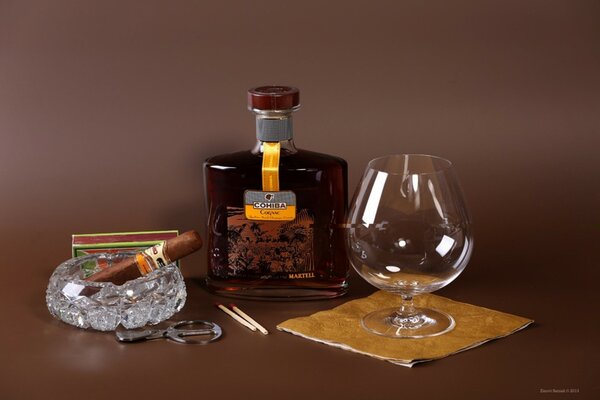 Foto di cognac bicchiere di sigaro