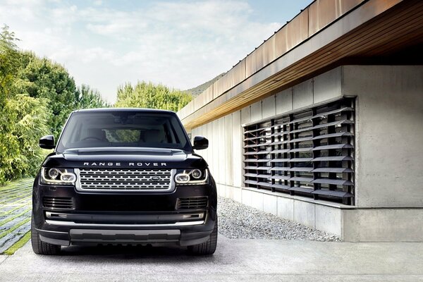 Black large land lover range rover with rectangular headlights