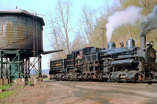 A steam locomotive drove past a water pump in western Maryland