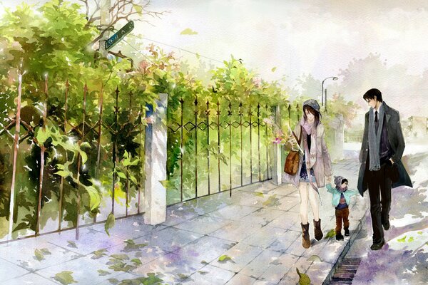 Mari, femme et enfant marchent près de la clôture