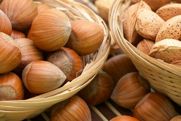 Almonds and hazelnuts in a wicker basket, nut paradise